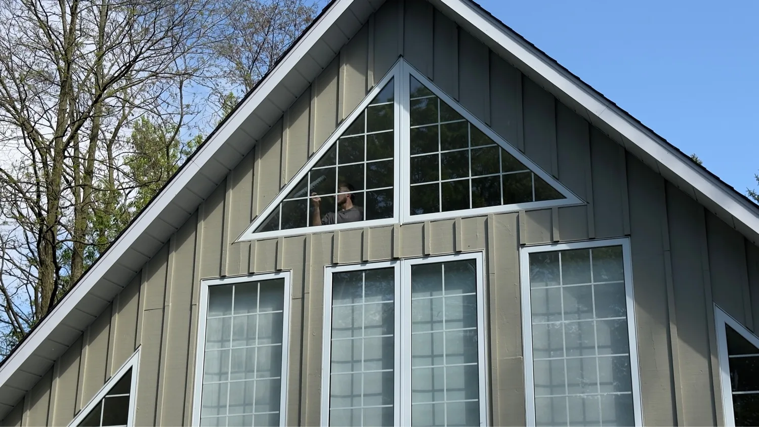 Final inspection and cleaning of newly installed gable window — D&D Exterior Finishing