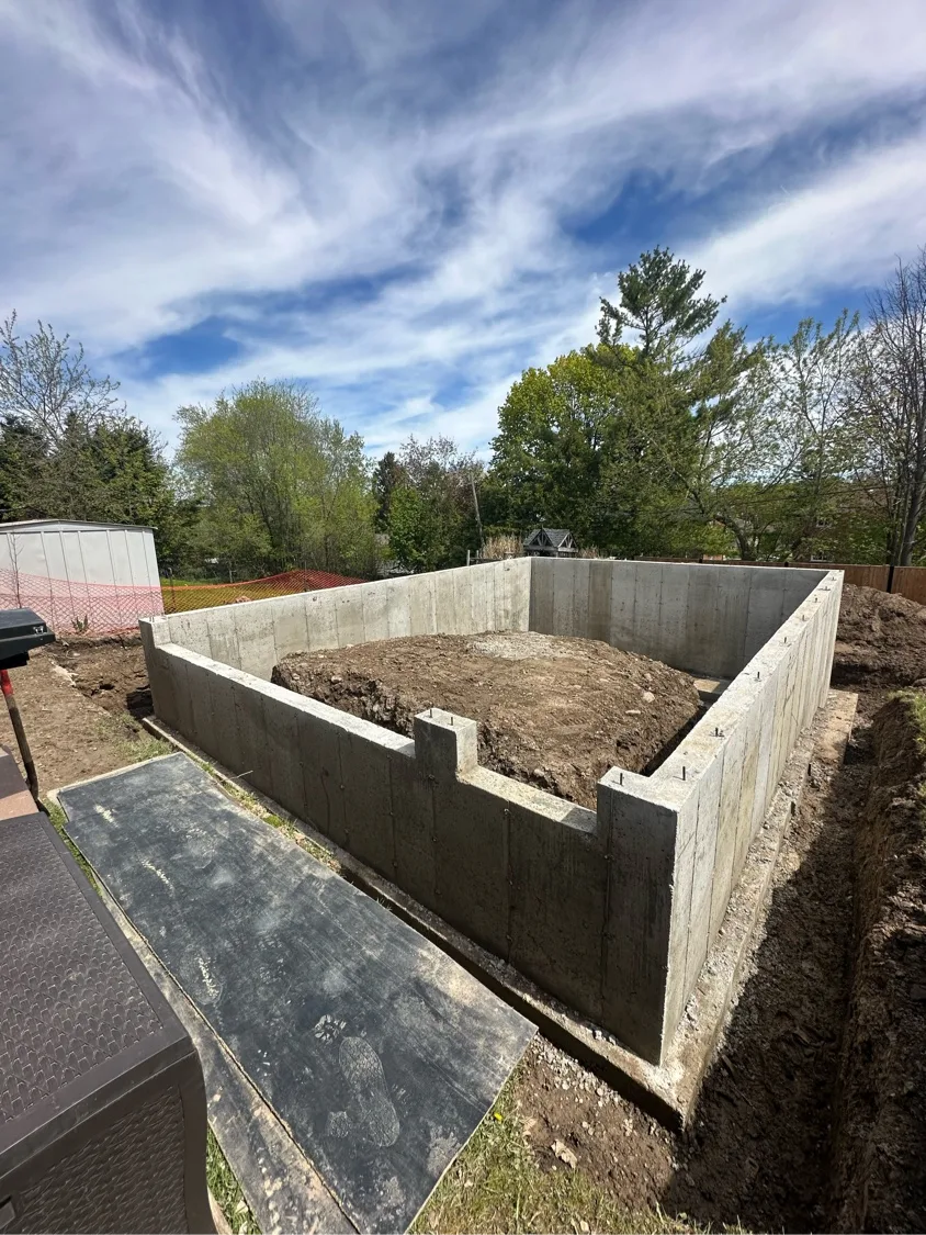 Poured concrete foundation wall installation in Kitchener-Waterloo by D&D Exterior Finishing
