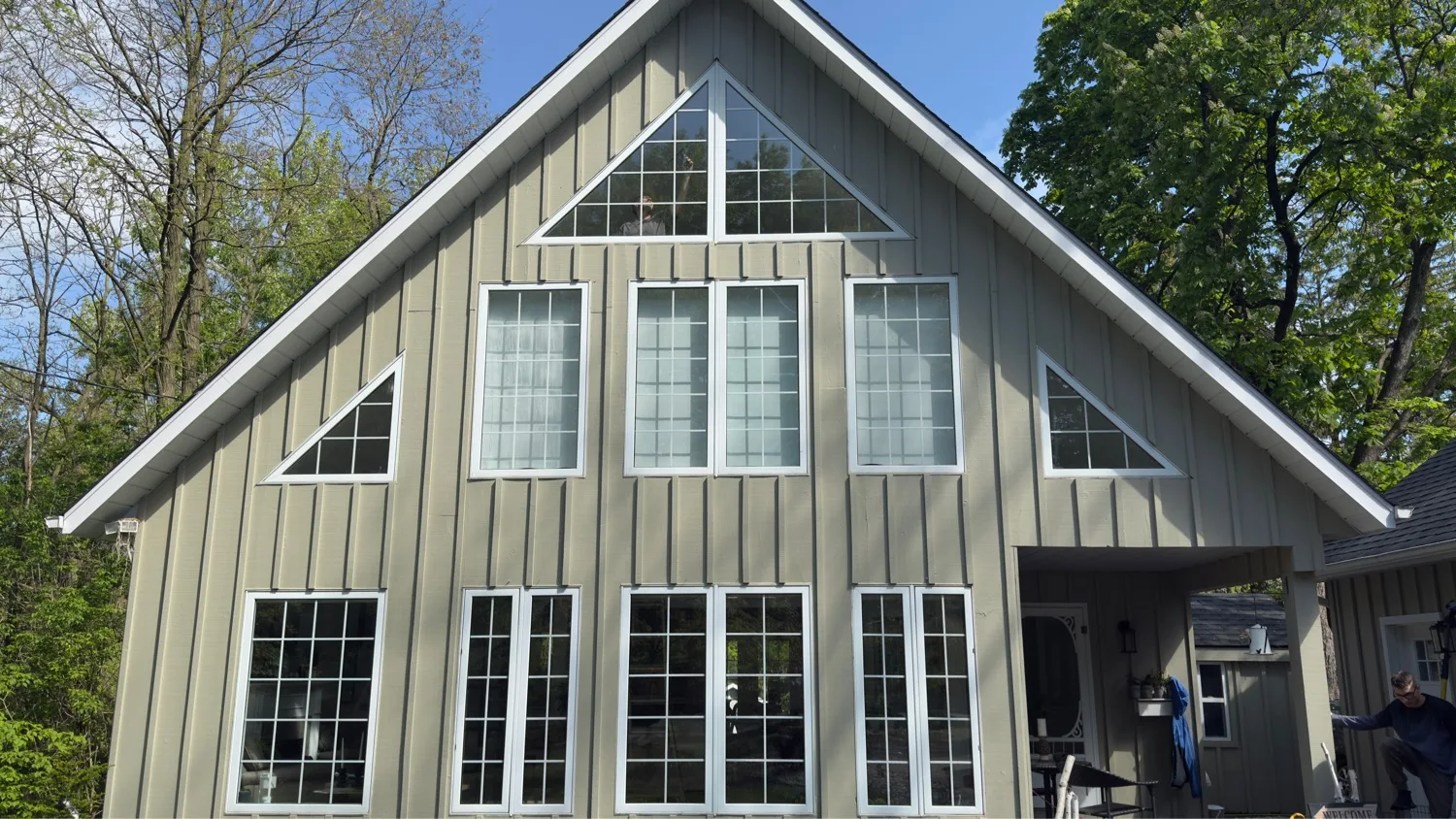 Custom window installation on A-frame gable home with triangular gable windows β D&D Exterior Finishing Kitchener-Waterloo
